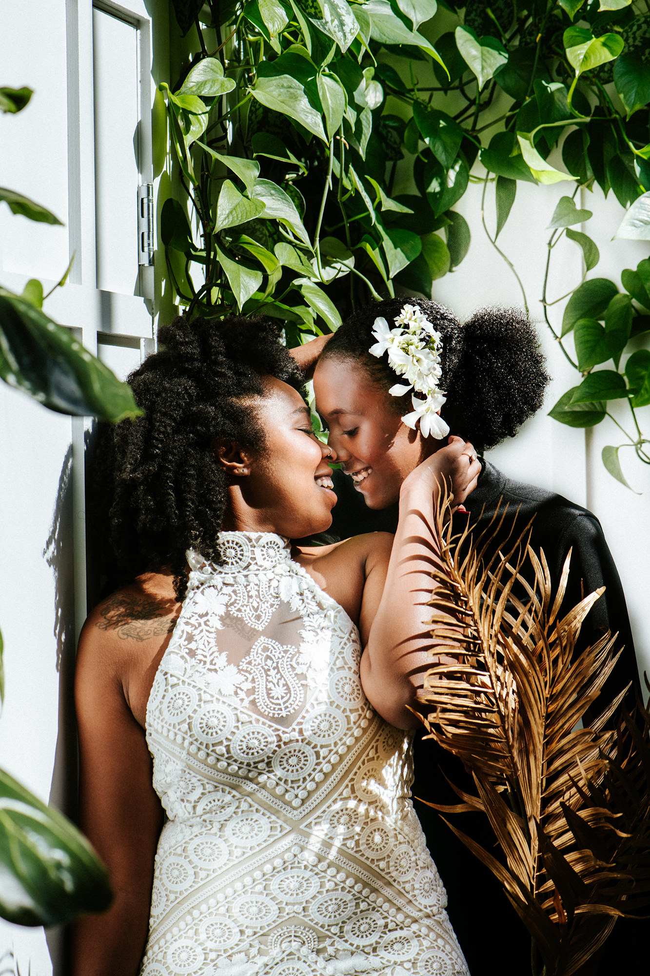 Black gay couple at their black and white wedding in San Diego